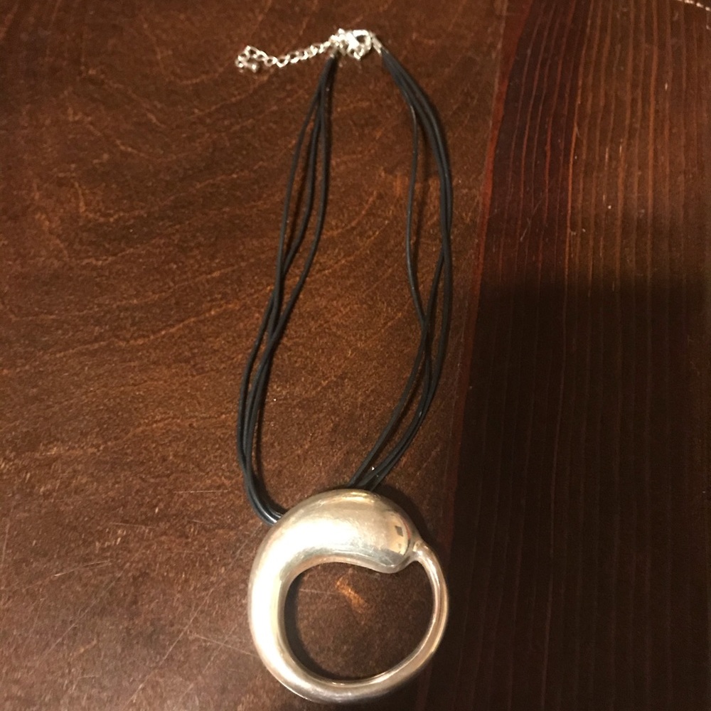A silver pendant for a necklace